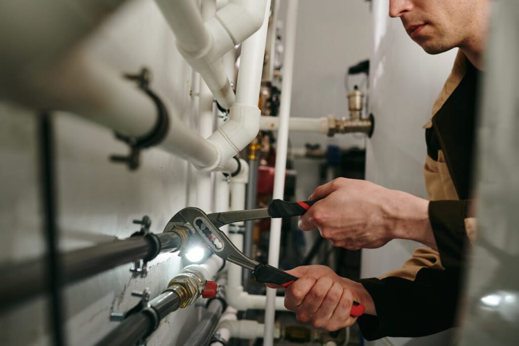 Plumbers maintaining commercial plumbing pipes in Desert Hot Springs